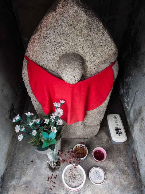 Buddhist statue at roadside shrine,  henro no michi trail, Shikoku  88 temple pilgrimage, Ehime, Japan
